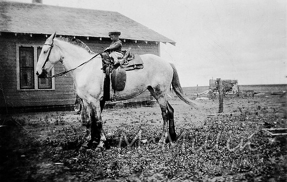 1926 Ray Owen on horse at home
