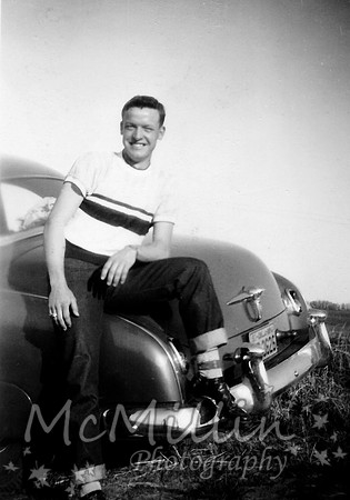 1950ish Melvin McMillin with car and socks